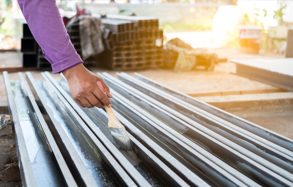 man is treating his steel - Tips for keeping your steel stainless
